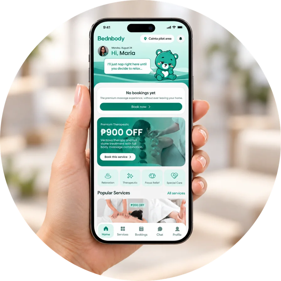 A hand holding a phone displaying the Bednbody app at home