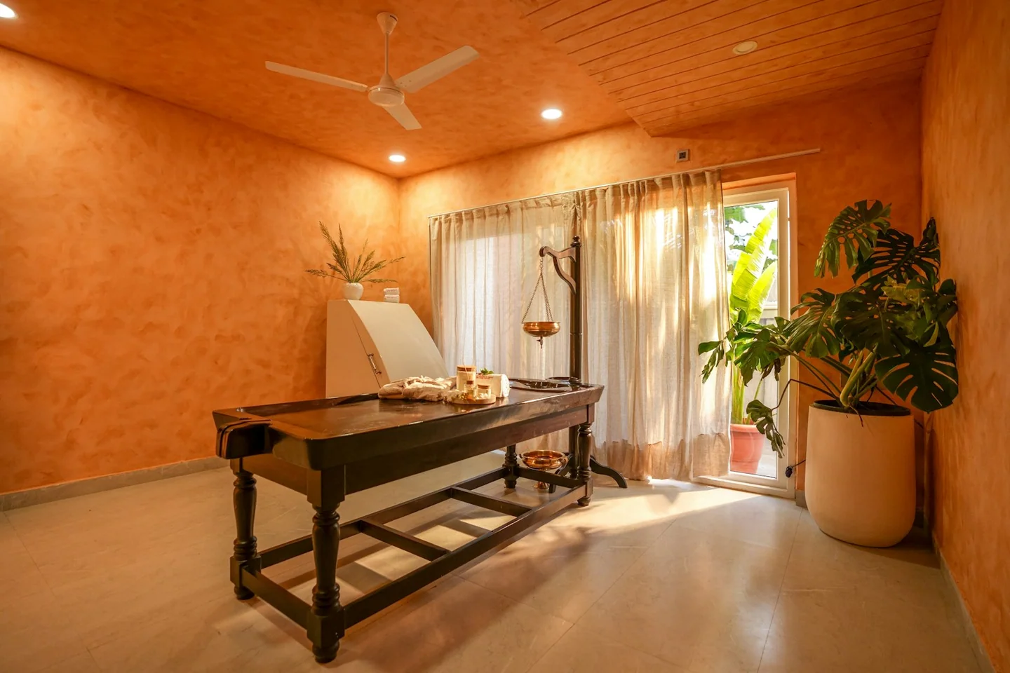 Massage table inside a dedicated spa treatment room